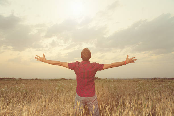 istock Man enjoying in nature. Wheat field. 616906836