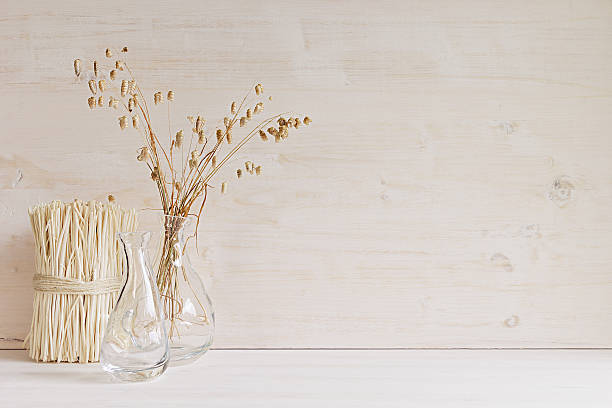 istock Home decor of   vase with spikelets  on white wood background. 616907030