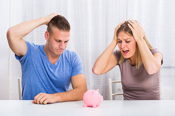 istock Couple in panic because of money saving 616907646