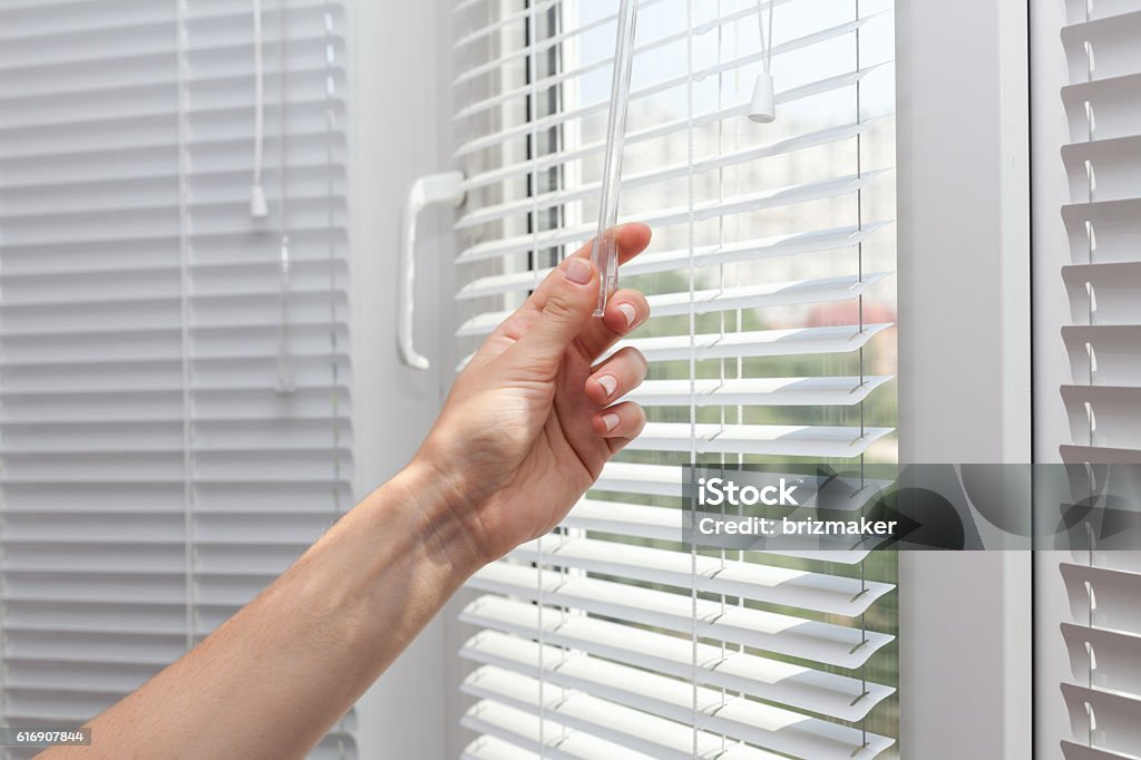 Adjustments room lighting range through the blinds Window Blinds Stock Photo