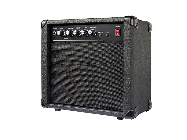 Photo of Small guitar amplifier isolated on white background