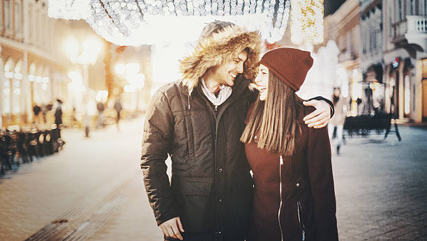 istock Couple having romantic walk on winter night. 616908296