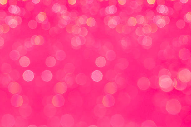 istock Bokeh glamour pink background with blurred rainbow lights. 617351648