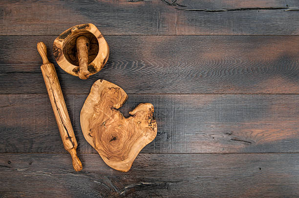 istock Kitchen utensils. Rolling pin, mortar and wooden board 617352502