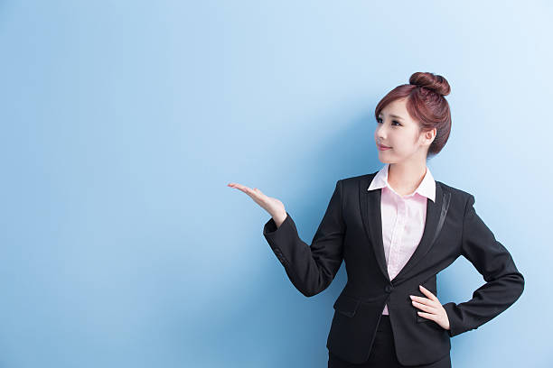 istock business woman show something 617352744