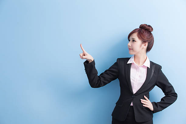 istock business woman show something 617352818