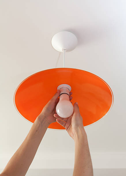 istock Close-up of energy-saving LED light bulb in the human hand 617353252