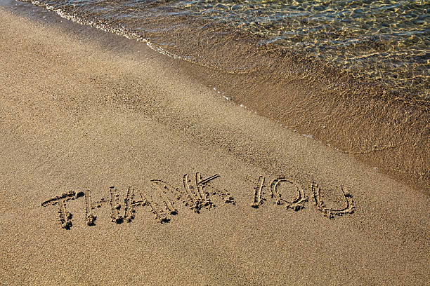 istock Thank you written in Sand on the beach 617353738
