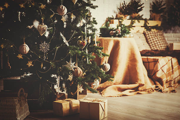 istock Christmas tree and presents in decorated living room 617354166