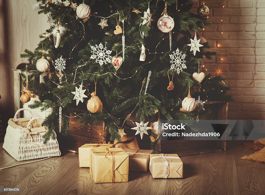 Christmas tree and presents in decorated living room Christmas tree and presents in decorated living room, Christmas and New Year concept Christmas Tree Stock Photo