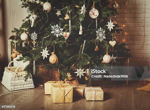 Christmas Tree And Presents In Decorated Living Room Stock Photo - Download Image Now