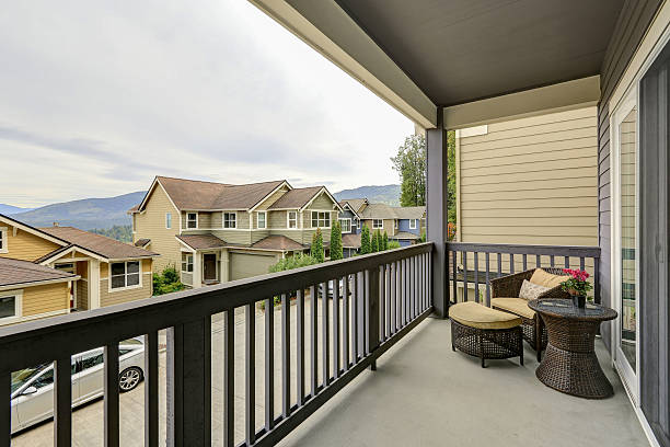 istock Covered balcony interior with wicker furniture 617356364