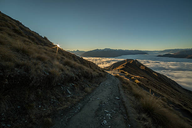 istock Last sun over the mountains and clouds 617357138