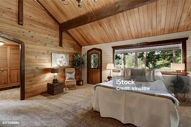 Wooden Bedroom Interior With High Beamed Ceiling Stock Photo - Download Image Now - Cottage, Indoors, Bedroom
