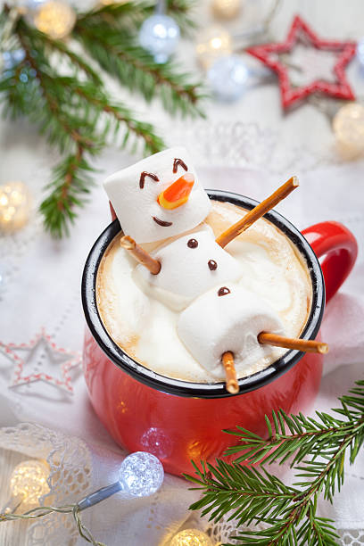 istock hot chocolate with melted marshmallow snowman 617359884