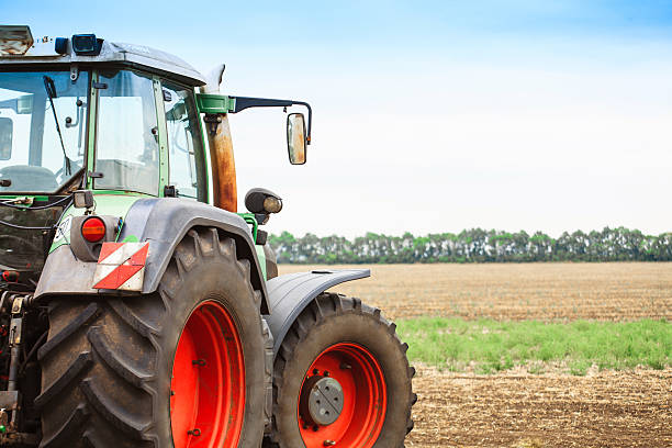 istock Rural landscape with a tractor 617360480