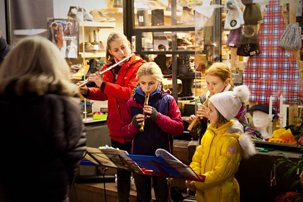 group of girls playing christmas songs stock photo