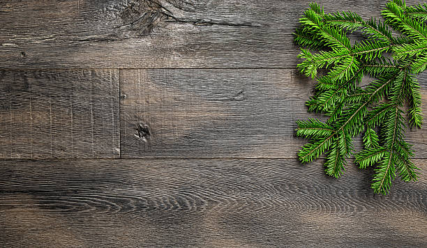 istock Christmas tree branches wooden texture. Retro holidays background 617361120