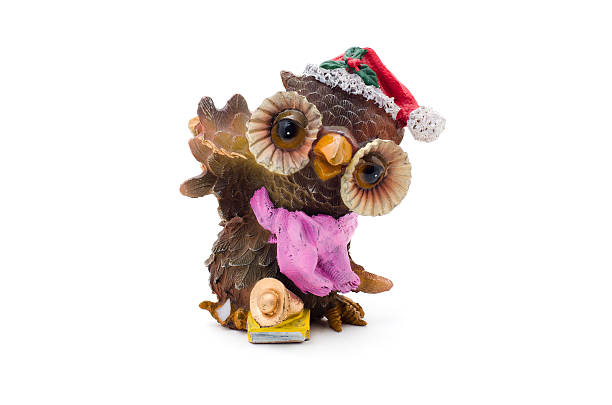istock Christmas owl figurine in the red hat. 617361166