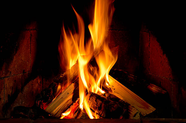 istock Burning wood in a fireplace 617361336