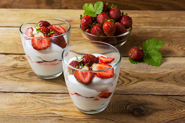 istock Layered dessert with cream, strawberry and ripe berries 617361830