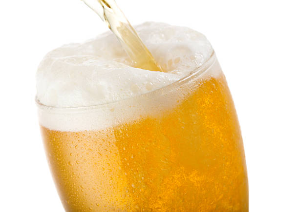 istock Beer pouring into glass 617362124