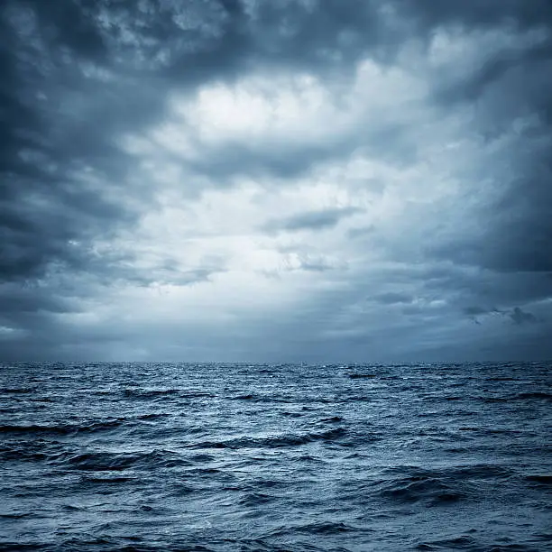 Photo of Stormy Sea and Sky. Dark Dramatic Background.