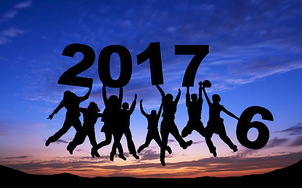 istock Crowd of friends jumping with 2017 617363160