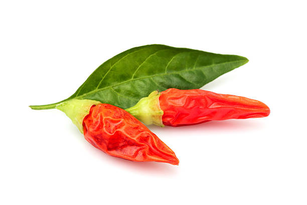 istock Dried chili peppers with leaves. 617363722