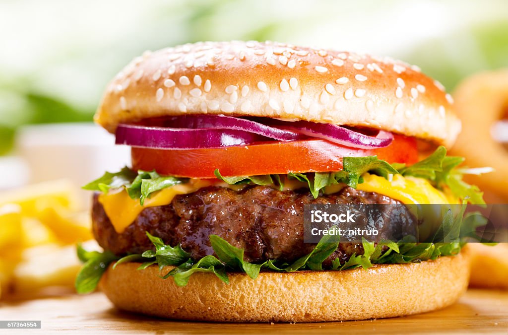 hamburger with fries hamburger with fries on wooden table Hamburger Stock Photo