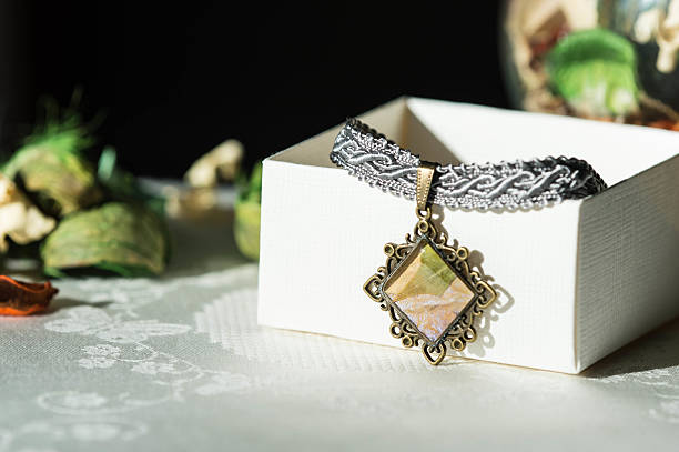 istock Handmade necklace with a bronze pendant from epoxy resin 617364894