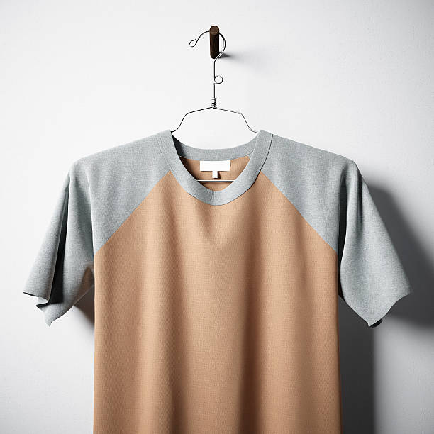istock Closeup of blank multicolor cotton tshirt hanging in center  empty 617365772