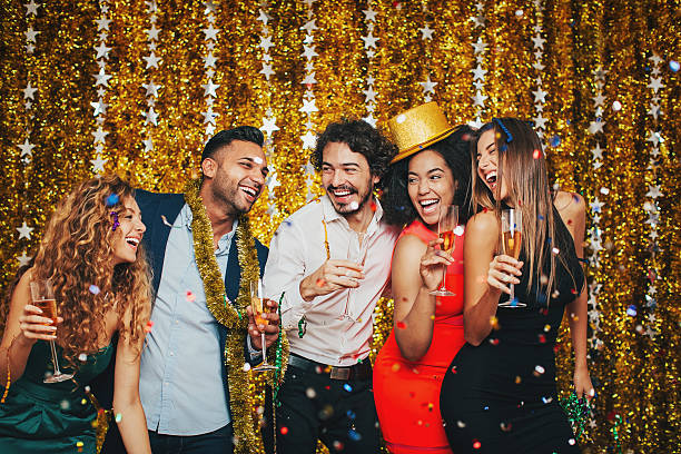 istock Happy group at glamorous party 617366288