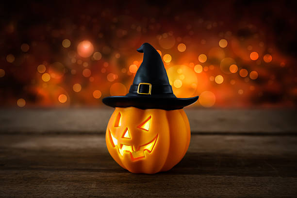 istock Halloween pumpkin head jack lantern on wooden background 617367102