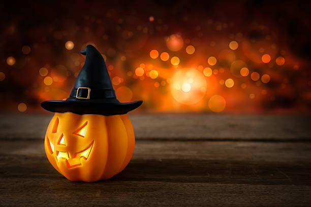 istock Halloween pumpkin head jack lantern on wooden background 617367330