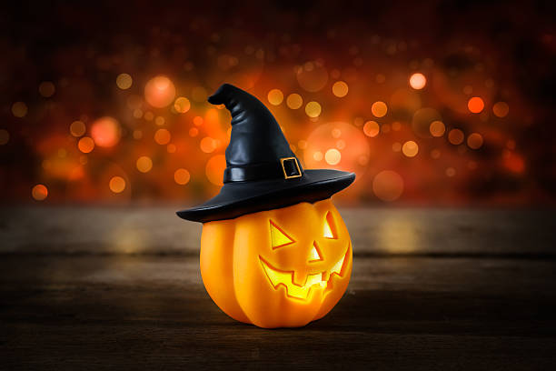 istock Halloween pumpkin head jack lantern on wooden background 617367344