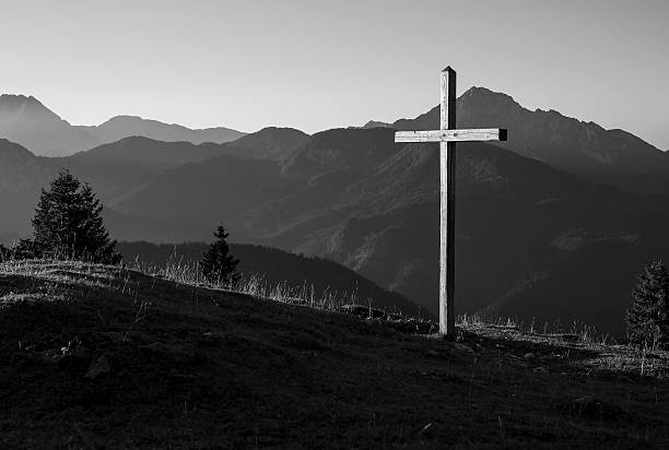 istock Mountain landscape with a wooden cross 617367394