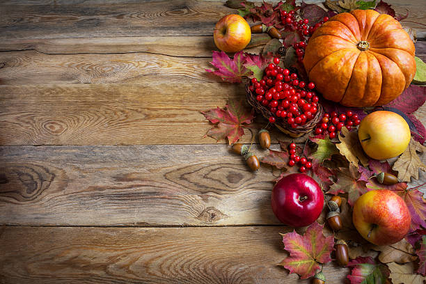 istock Thanksgiving  greeting background with orange pumpkins, apples a 617369284