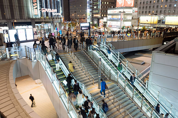 pendler vor dem bahnhof osaka. - umeda stock-fotos und bilder