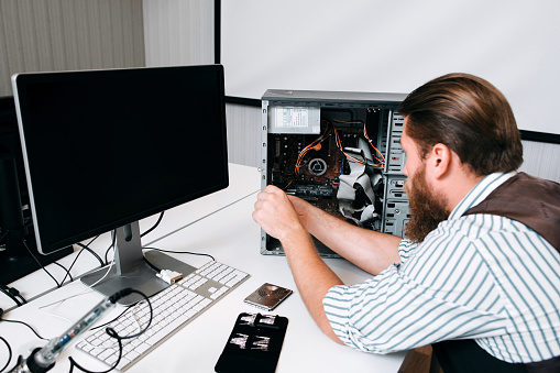 Computer Master Disassembling Cpu With Tools Stock Photo - Download ...