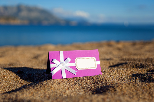 Group of multicolored gift boxes on a beach