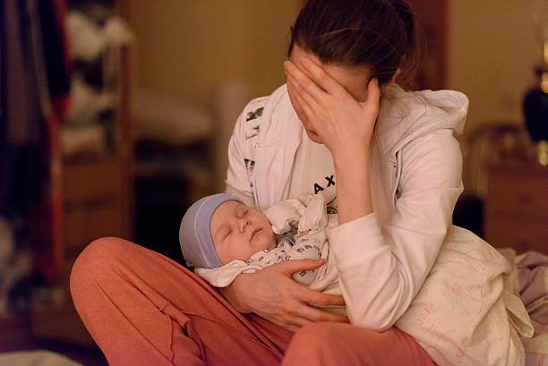 istock mother and sleeping baby 617374028
