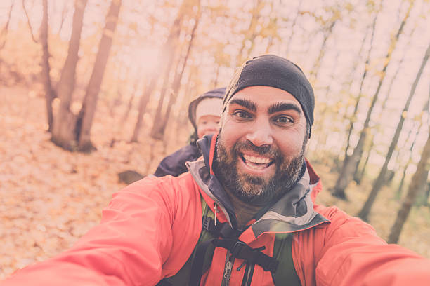 istock Father Backpacking Hiking with Baby in Forest 617374404
