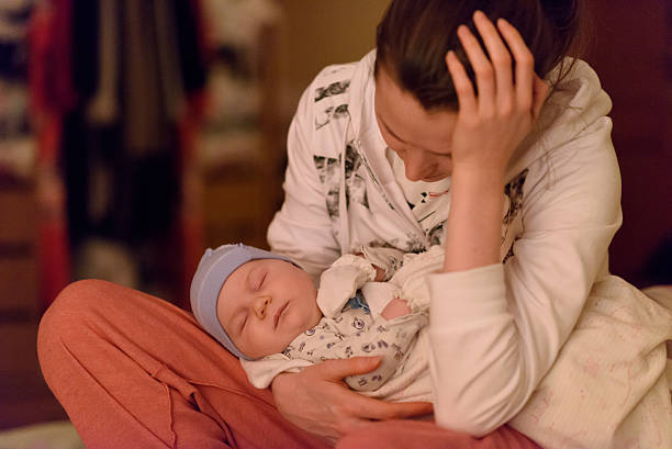 istock mother and sleeping baby 617374420