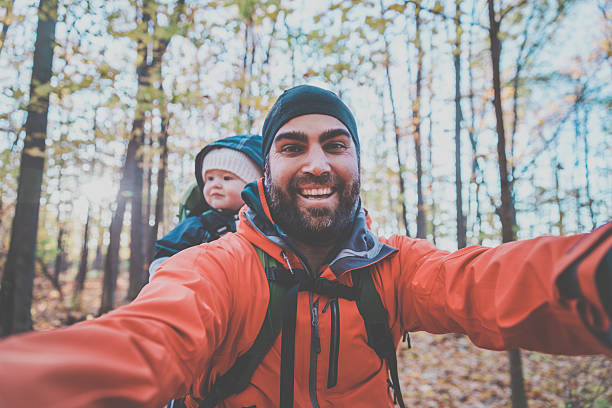Father Backpacking Hiking with Baby in Forest