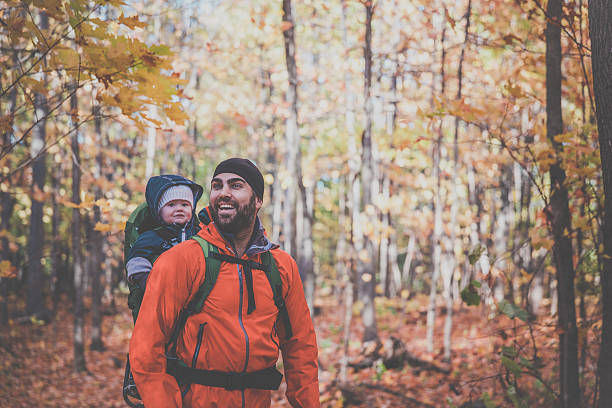 istock Father Backpacking Hiking with Baby in Forest 617374628