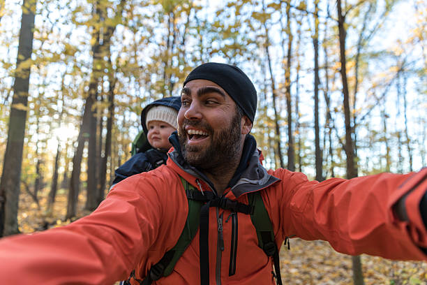istock Father Backpacking Hiking with Baby in Forest 617374726