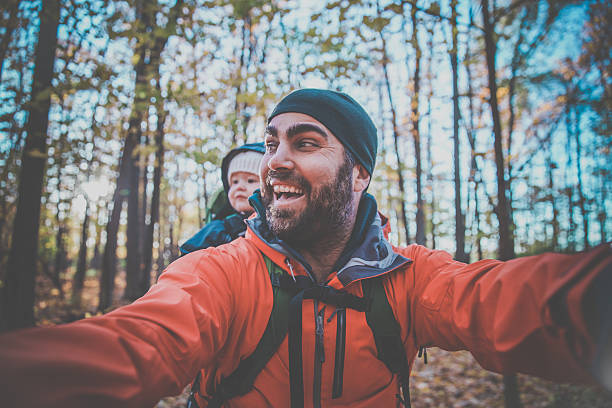 istock Father Backpacking Hiking with Baby in Forest 617374760
