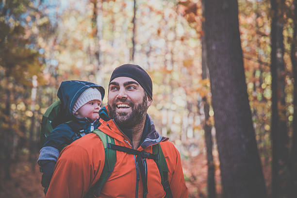istock Father Backpacking Hiking with Baby in Forest 617374952