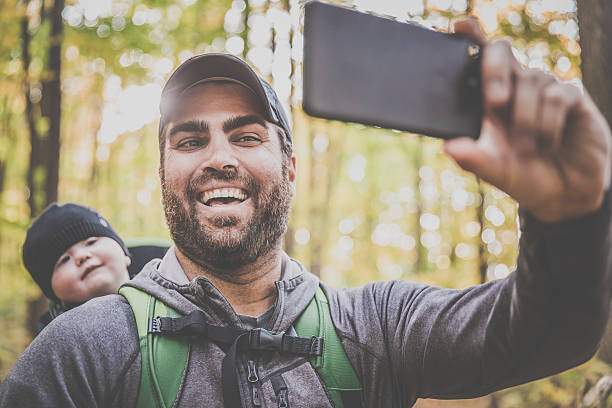 istock Father Taking Selfie with Baby in Forest 617375364